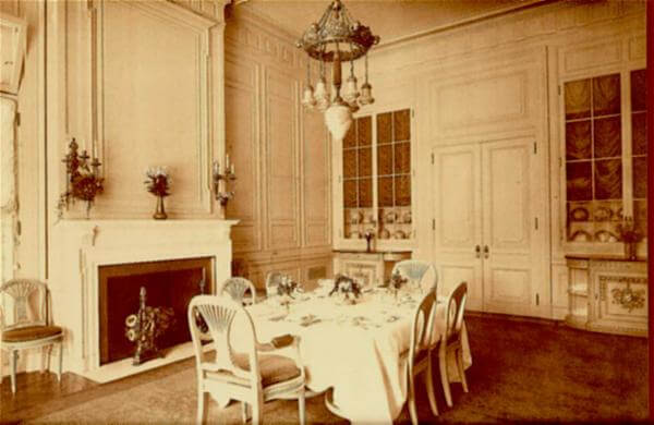 Photo of dining room at the Guggenheim Mansion shows the original hand-blown glass chandelier that's still in place,